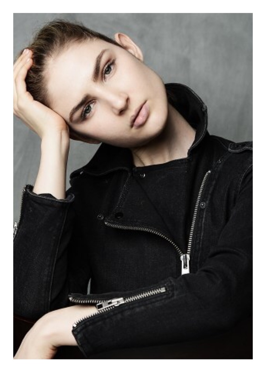 Ali Kirsch in a close editorial portrait wearing a black jacket