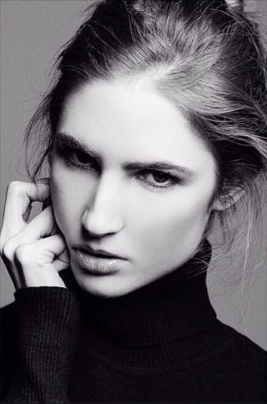 Ali Kirsch in a black-and-white close beauty portrait