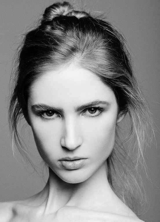Ali Kirsch in a black-and-white front-facing beauty portrait
