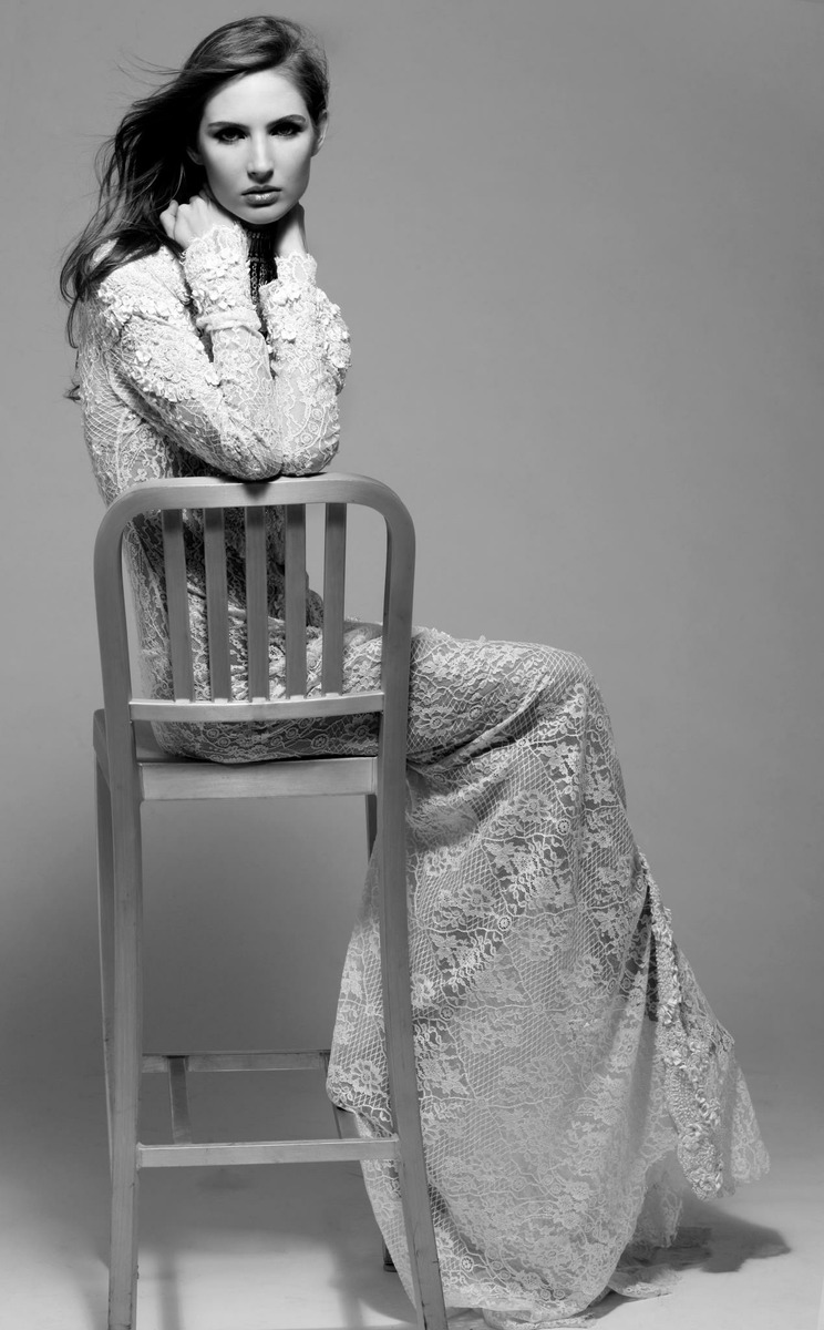 Ali Kirsch in a black-and-white seated editorial portrait