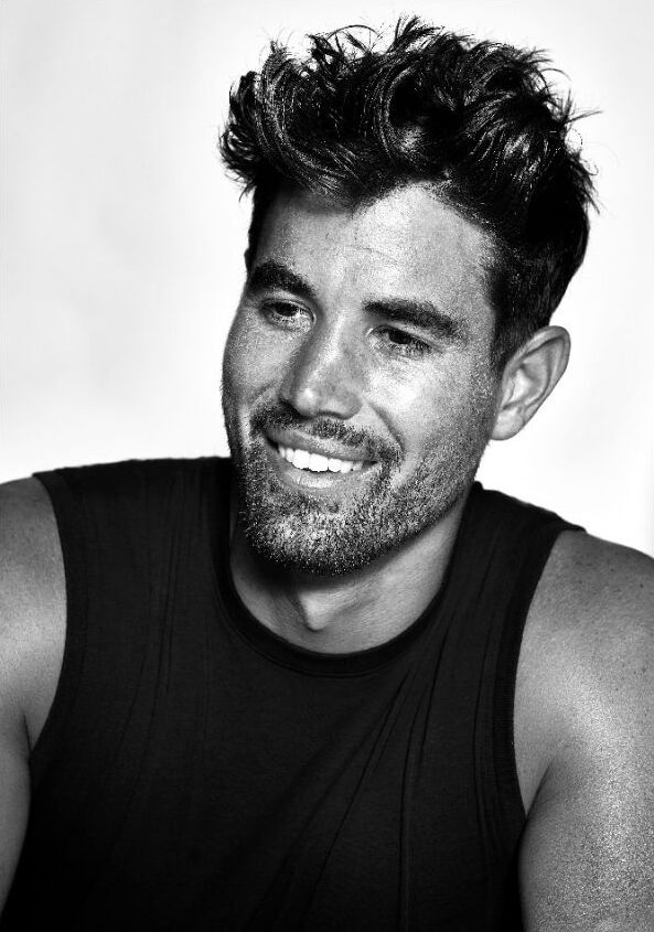 Chasen smiling in a black sleeveless top — portfolio photograph