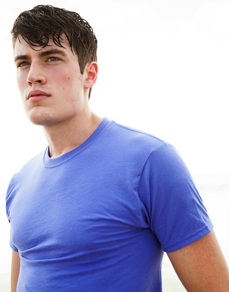Stephen wearing a blue shirt in a color fashion portrait