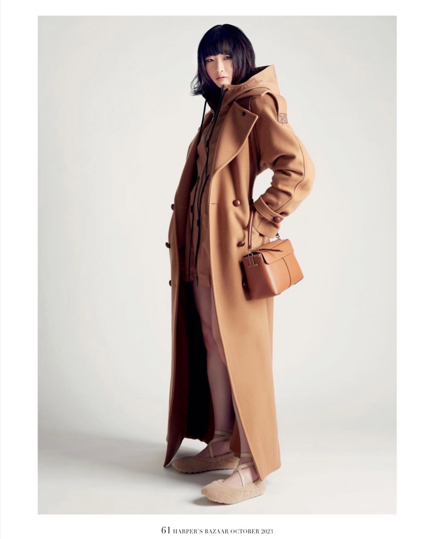 Tian in a caramel overcoat fashion editorial