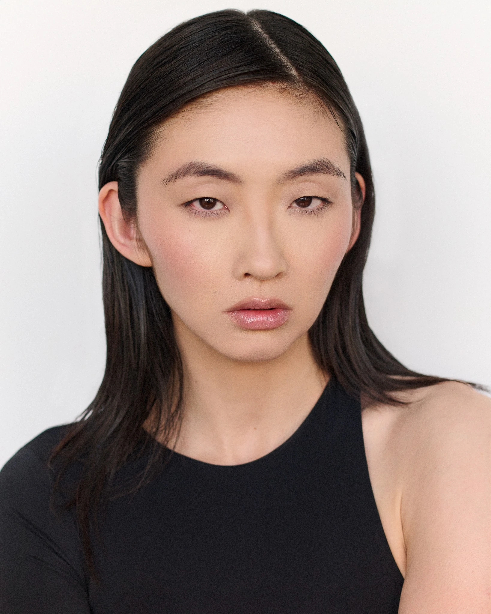 Tian in a beauty portrait wearing a black top, scouted by Matthew David